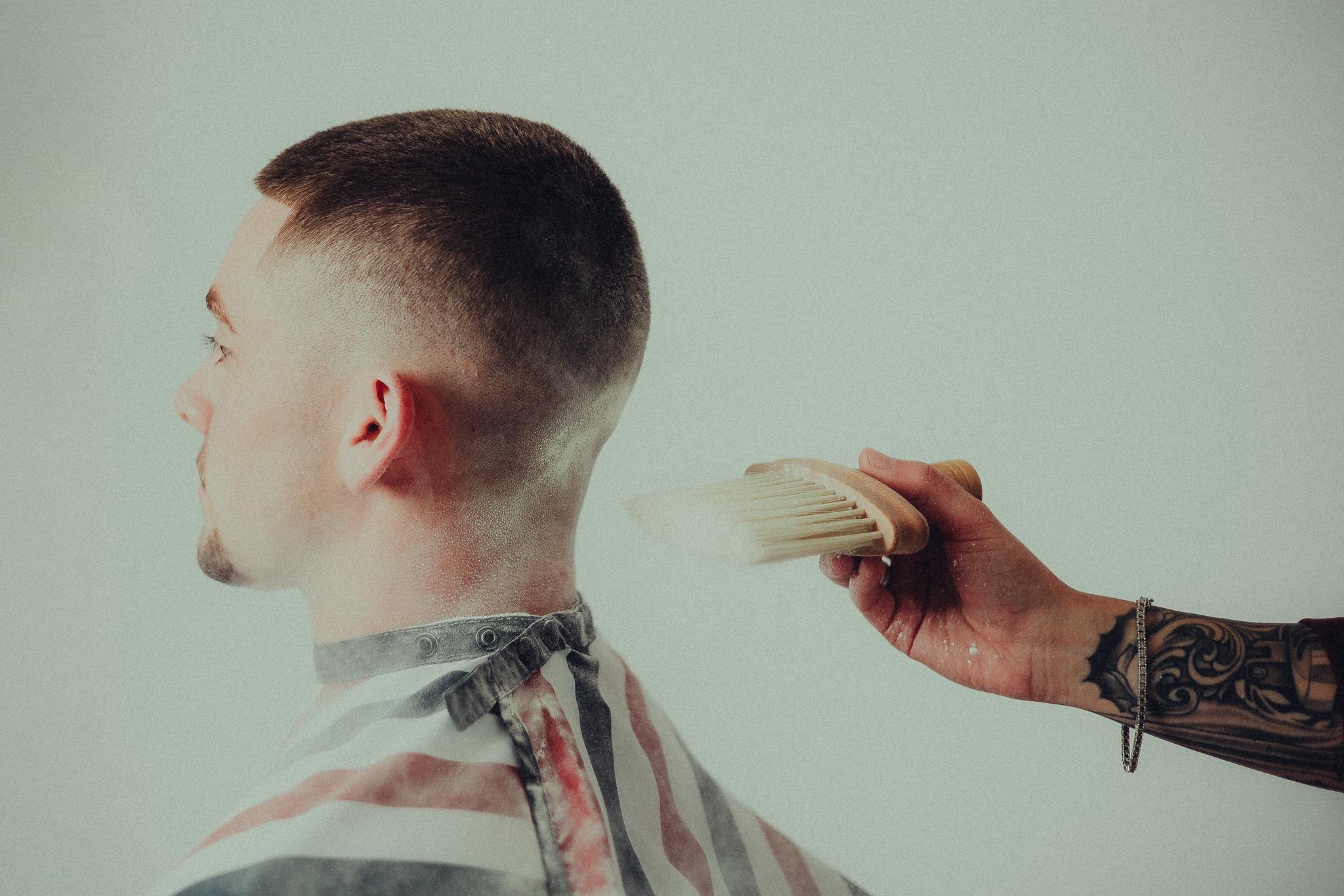 Clean skin fade finished with neck brush at The Edge Barbershop Linton IN